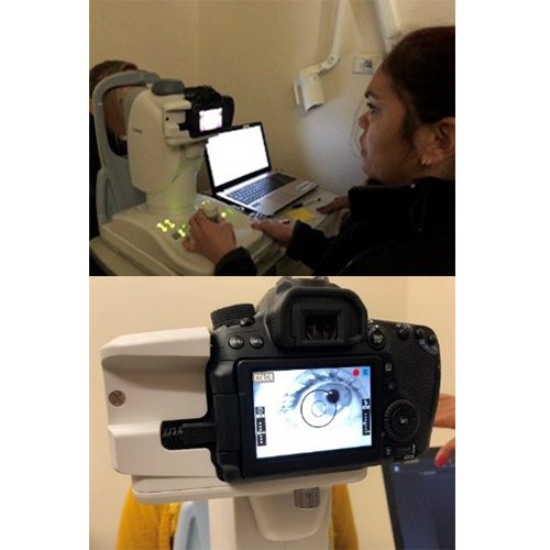 Staff member using a retinal camera